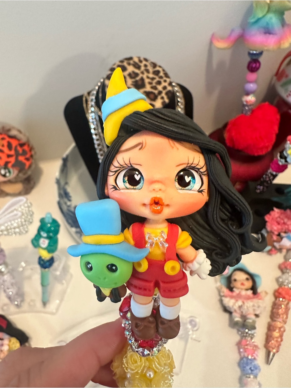 Female pinocchio clay pen